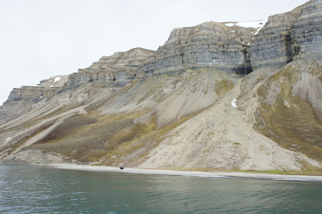 If you look toward the upper right, you can see a waterfall. The little boat on shore wrecked decades ago.